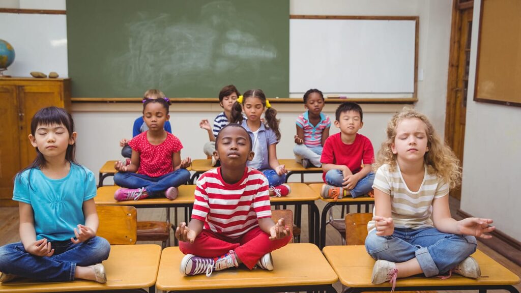 Students Meditating on desks picture